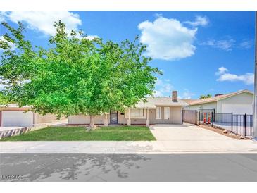 Charming single-story home with a well-maintained lawn and mature tree at 5376 Hillsboro Ln, Las Vegas, NV 89120
