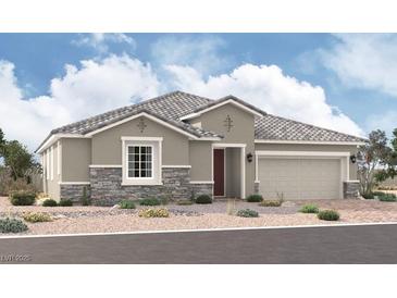 Charming single-story home features a stone veneer, neutral paint, tile roof, and a well-manicured desert landscape at 5753 E Badlands Ln, Pahrump, NV 89061