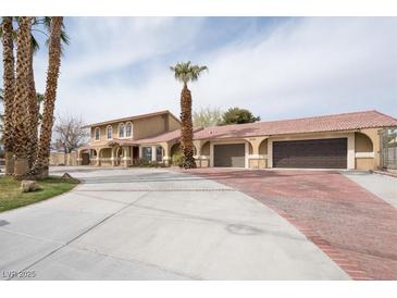 Spacious home features a well manicured yard, mature palm trees, and a large driveway for ample parking at 6130 Tara Ave, Las Vegas, NV 89146