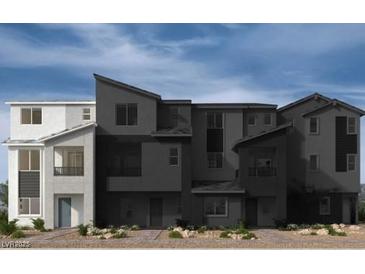 A modern exterior view of newly constructed townhomes showing contemporary architectural design and neutral color palettes at 9241 Soho Sky Ct, Las Vegas, NV 89148