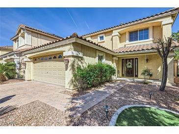 Charming two-story home with a well-maintained yard and a two-car garage at 10900 Calcedonian St, Las Vegas, NV 89141