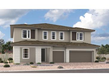 Contemporary two-story home featuring a two-car garage, neutral stucco, stone accents, and a well-manicured desert landscape at 1155 Viento View Ave, Henderson, NV 89012