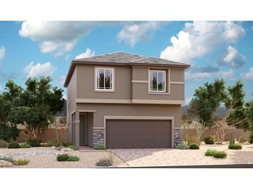 Charming two-story home with a two car garage, neutral paint, and landscaped front yard at 4795 Illustria Ave, Las Vegas, NV 89141
