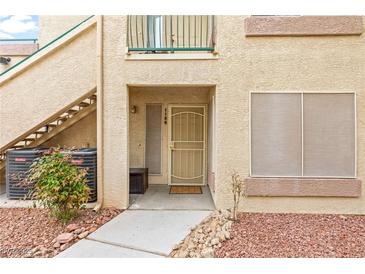 Inviting condo front door with secure screen door, stylish decor, and well-maintained surroundings at 5710 E Tropicana Ave # 1166, Las Vegas, NV 89122