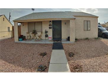 Charming single-story home featuring desert landscaping and a cozy covered porch entry at 110 Palm Ln, Las Vegas, NV 89101