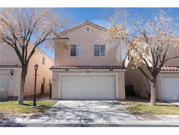 Charming two-story home with a well-maintained front yard and a two-car garage at 5461 Dungaree St, Las Vegas, NV 89118