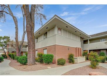 Attractive condo featuring brick accents, mature trees and well-maintained landscaping at 746 Oakmont Ave # 708, Las Vegas, NV 89109