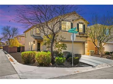 Charming two-story home with stucco exterior, manicured landscaping, and attached two-car garage at 7529 Earnshaw Avenue Ct, Las Vegas, NV 89179