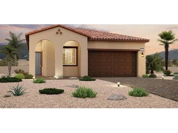 Charming single-story home featuring a tile roof, arched entryway, and low-maintenance desert landscaping at 820 Weston Ridge St, Henderson, NV 89011