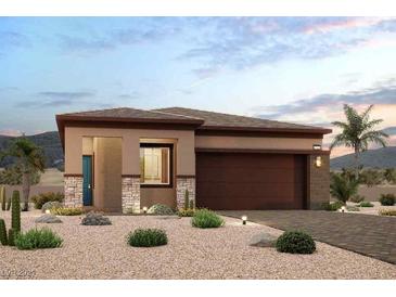 Charming single-story home featuring desert landscaping, a two-car garage, and a welcoming entryway at 824 Weston Ridge St, Henderson, NV 89011