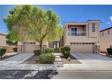 Charming two-story home featuring stone accents, mature landscaping, and a convenient three-car garage at 4129 Fabulous Finches Ave, North Las Vegas, NV 89084