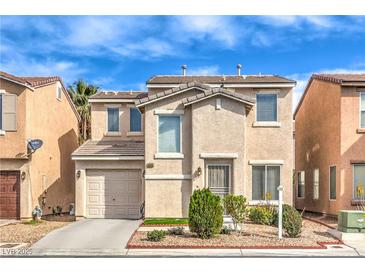 Charming two-story home featuring a private garage and front yard landscaping at 6066 El Sol Dr, Las Vegas, NV 89142
