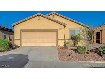 Charming one story home with an attached two car garage and desert landscaping at 980 Aspen Cliff Dr, Henderson, NV 89011