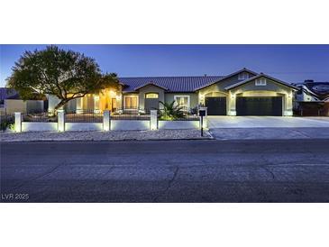 Charming single-story home with manicured landscaping, three-car garage, and RV parking at 1630 Sundown Dr, Henderson, NV 89002