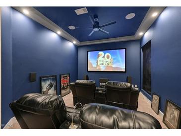 Home theater featuring comfortable leather seating, a large screen, and surround sound at 2931 Raywood Ash Dr, Las Vegas, NV 89138