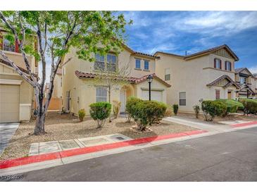 Charming two-story home with a tidy front yard, inviting curb appeal, and attached garage at 4224 Glisan Ct, Las Vegas, NV 89129
