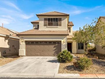 Charming two-story home with a well-manicured front yard and a two-car garage at 5120 First Sun St, North Las Vegas, NV 89081