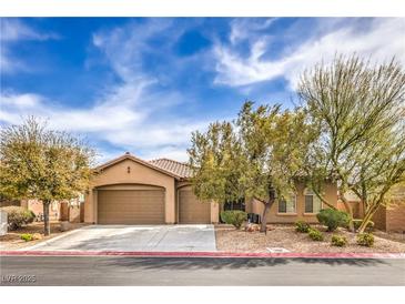 Charming single story home with a three car garage and mature landscaping at 7264 Summer Duck Way, North Las Vegas, NV 89084