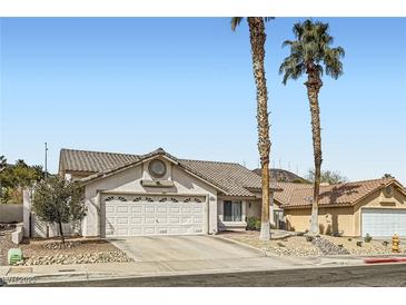 Inviting single-story home with a well-maintained yard and two-car garage at 841 Rusty Anchor Way, Henderson, NV 89002