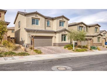 Charming two-story home with desert landscaping, paved driveway, and two car garage at 10376 Sadie Blake Ave, Las Vegas, NV 89166