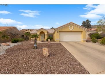 Charming single-story home with a well-maintained yard and attached two-car garage at 10505 Linden Wood Ct, Las Vegas, NV 89134