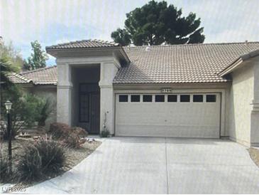 Charming single-story home featuring a well-manicured front yard and a two-car garage at 5709 Colwood Ln, Las Vegas, NV 89130