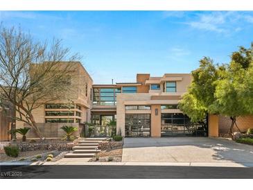 Stunning two-story home with modern architecture, desert landscaping, and a spacious three-car garage at 39 Coralwood Dr, Las Vegas, NV 89135