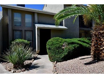 Charming condo with well-maintained landscaping and inviting entryway on a sunny day at 516 Sellers Pl, Henderson, NV 89011