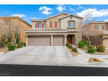Charming two-story home featuring a three-car garage and landscaped front yard at 9120 Mastodon Ave, Las Vegas, NV 89149