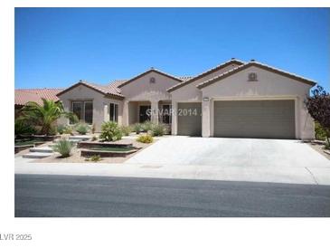 Charming single story home featuring a three car garage and drought resistant landscaping at 2324 Orangeburg Pl, Henderson, NV 89044