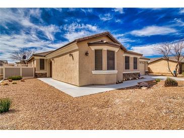 Charming single-story home with neutral stucco, stone accents, and a well-maintained gravel front yard at 3891 Sedgwick, Pahrump, NV 89061