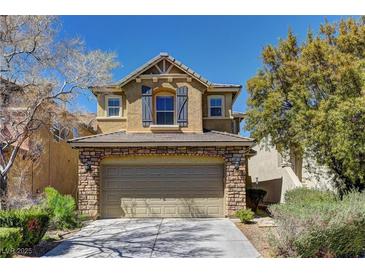 Charming two-story home with a stone-accented front and attached two car garage at 6457 Lovett Canyon St, Las Vegas, NV 89148