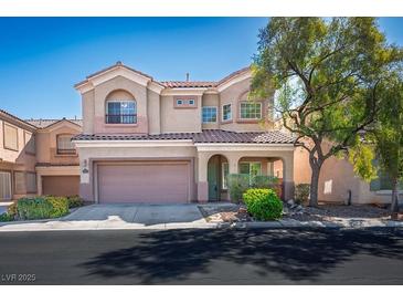 Charming two-story home features a two-car garage, tiled roof, and landscaped front yard at 7624 Molfetta St, Las Vegas, NV 89149