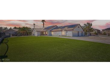 Charming single-story home with well-manicured lawn and solar panels offers sustainable living at 8515 Belcastro St, Las Vegas, NV 89113