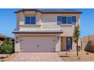 Charming two-story home featuring a spacious two-car garage and a well-manicured front yard, perfect for Gathering living at 2606 Lily Point St, Las Vegas, NV 89156