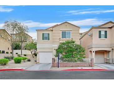Inviting two-story home with a charming front yard and an attached one car garage at 3457 Abilene Gold Ct, Las Vegas, NV 89129