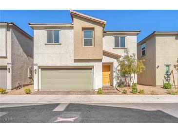 Inviting two-story home with a neutral color scheme and a two-car garage at 6952 Crimson Shadow St, North Las Vegas, NV 89086