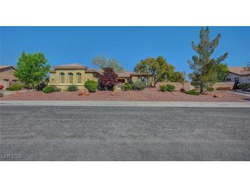 Beautiful single-story home with desert landscaping and a tile roof under a clear blue sky at 8370 Unicorn St, Las Vegas, NV 89131