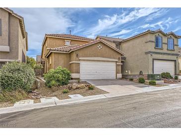 Charming two-story home featuring a spacious driveway, two-car garage, and well-maintained landscaping at 9557 Cabot Falls Ave, Las Vegas, NV 89149