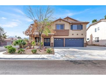 Inviting two-story home featuring a three-car garage, desert landscaping, and a welcoming covered front porch at 1307 Summer Dawn Ave, Henderson, NV 89014