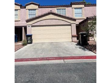 Charming townhome featuring a two-car garage and well-maintained landscaping at 2500 Sierra Bello Ave # 102, Las Vegas, NV 89106