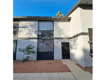 Charming condo featuring stucco siding, dual pane windows, and a well-maintained front yard at 3420 Mercury St # H, North Las Vegas, NV 89030
