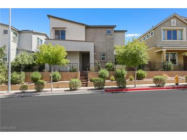 Contemporary two-story home with desert landscaping and dark trim, located in a vibrant community at 410 Gracious Way, Henderson, NV 89011