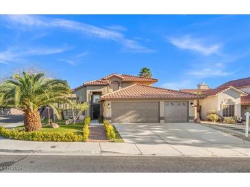 Charming single-Gathering home featuring a well-maintained yard, desert landscaping, and a spacious three-car garage at 5628 Crimson Ridge Dr, Las Vegas, NV 89130