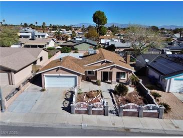Charming single-story home with a well-maintained yard and an attached two-car garage at 6620 Casa Linda Dr, Las Vegas, NV 89103