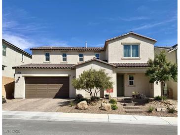 Charming two-story home featuring a spacious garage and landscaped front yard at 10172 Bismarck Palms Ave, Las Vegas, NV 89166