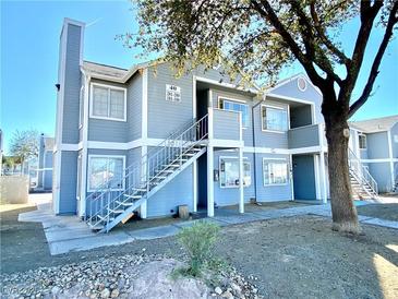Charming two-story apartment building with a well-maintained exterior and inviting staircase entrance at 1912 Nebula Dr, Las Vegas, NV 89115