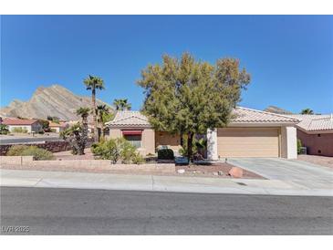 Charming home featuring desert landscaping with a mountain backdrop and two-car garage at 2739 Darby Falls Dr, Las Vegas, NV 89134