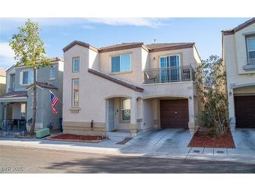 Charming two-story home featuring an attached garage and small balcony at 9105 Captivating Ave, Las Vegas, NV 89149