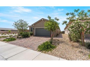 Charming home with low maintenance desert landscaping and brick paver driveway at 2243 Albury Ave, North Las Vegas, NV 89086